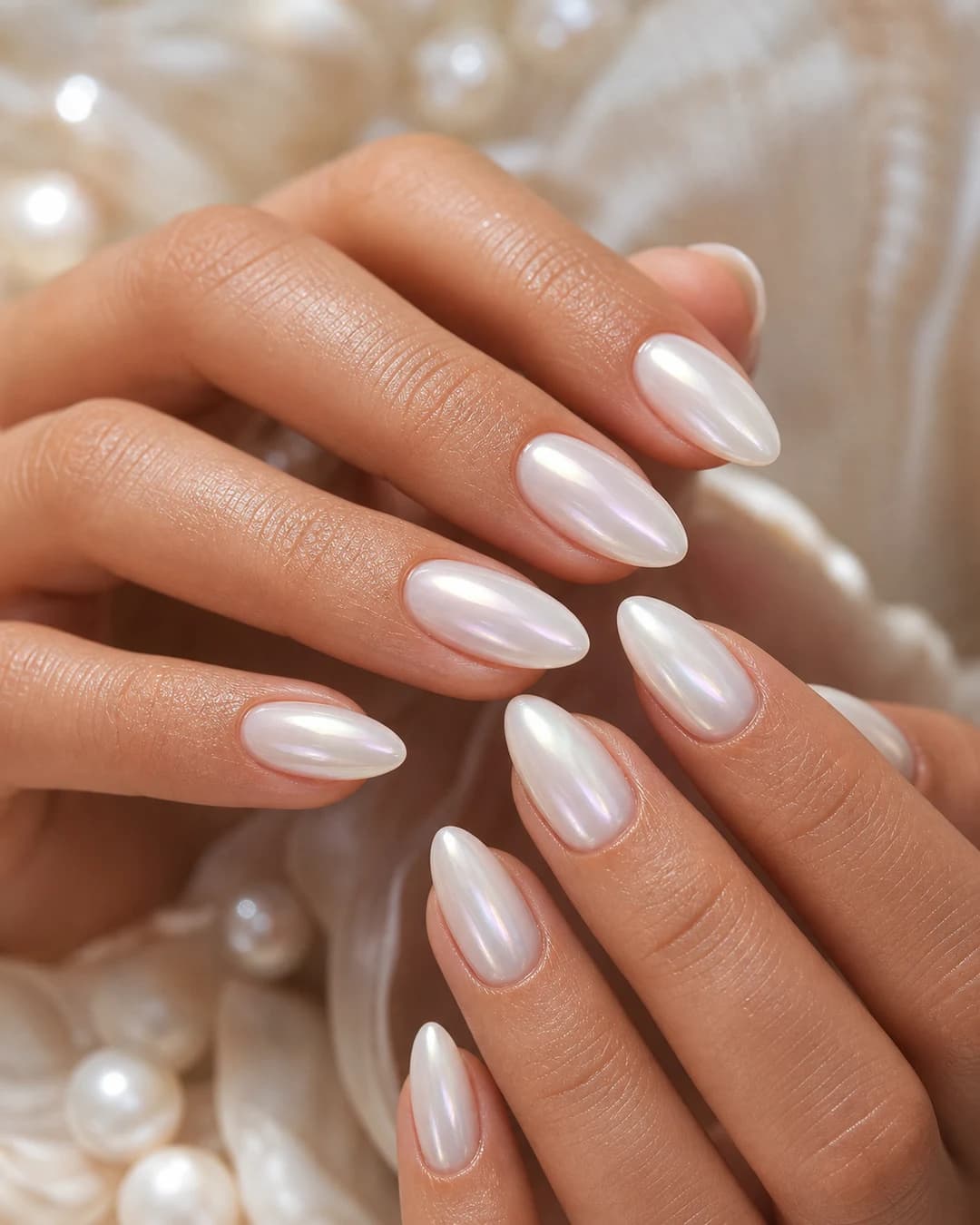 Milky nails finished with an iridescent pearly glazed top coat
